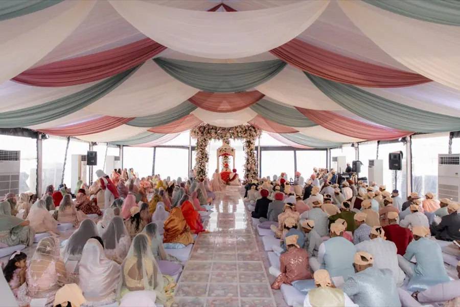The same pavilion filled with guests during the ceremony